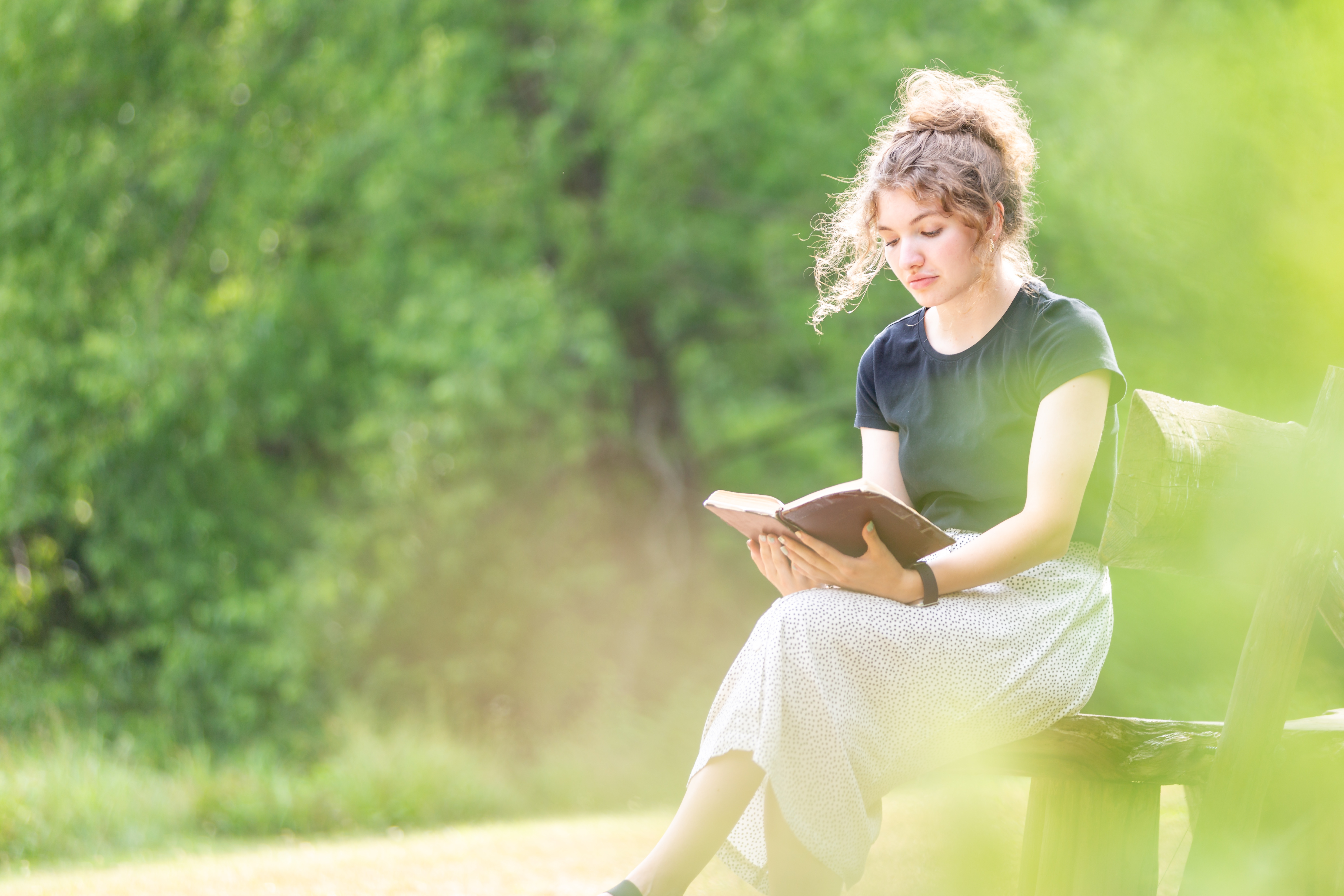 Young woman reading the Bible.
